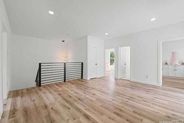 interior space with recessed lighting, baseboards, and light wood-type flooring