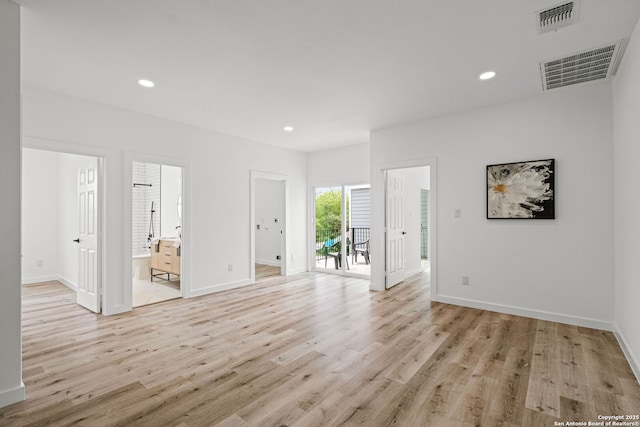 unfurnished living room featuring recessed lighting, light wood finished floors, and visible vents