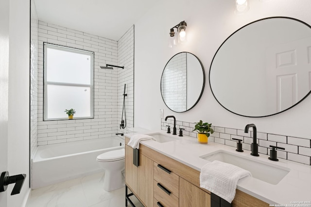full bathroom featuring double vanity, a sink, backsplash, and toilet