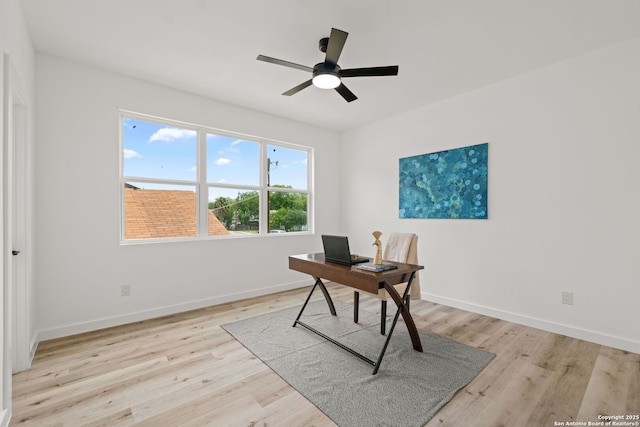 office with baseboards, ceiling fan, and wood finished floors