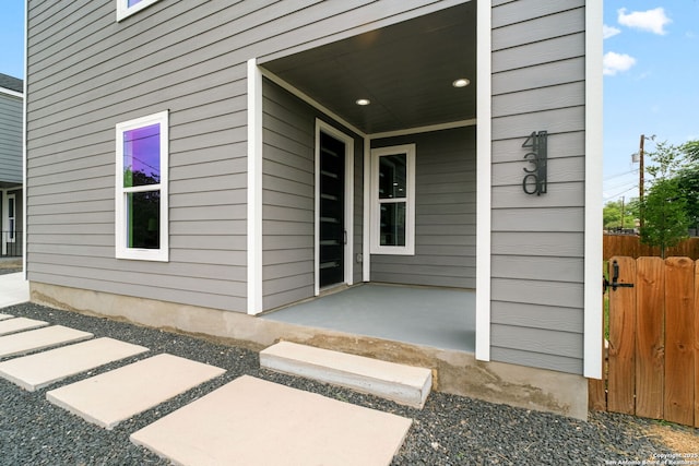 doorway to property with fence