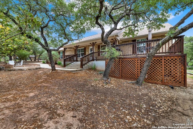 back of property with a porch