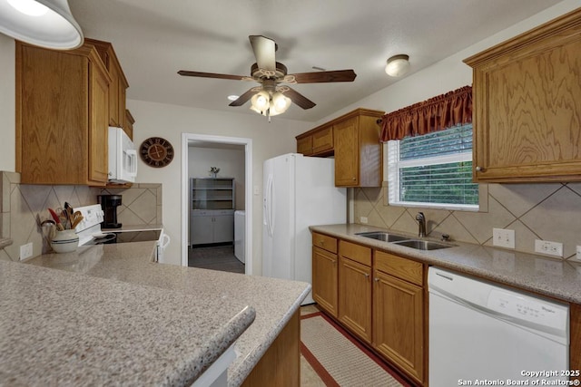 kitchen featuring a sink, white appliances, ceiling fan, backsplash, and light countertops