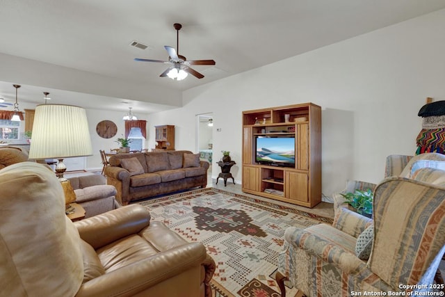 living room featuring a ceiling fan, baseboards, and visible vents