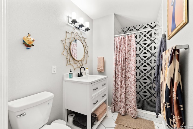full bath with toilet, tile patterned flooring, vanity, and a tile shower