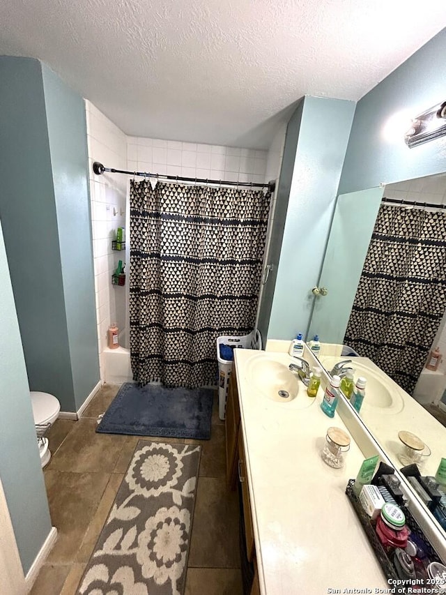 full bathroom with toilet, vanity, shower / bathtub combination with curtain, and a textured ceiling