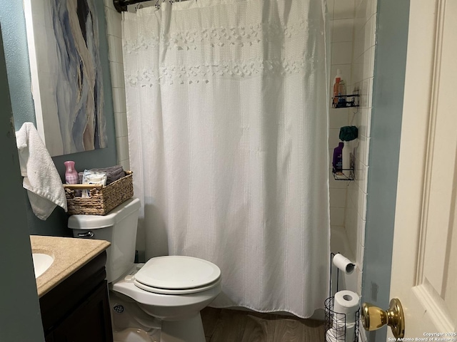 full bathroom featuring toilet and vanity