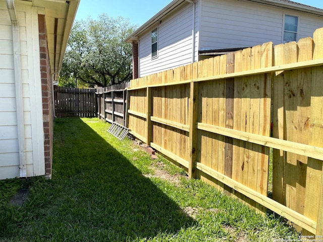 view of yard with a fenced backyard