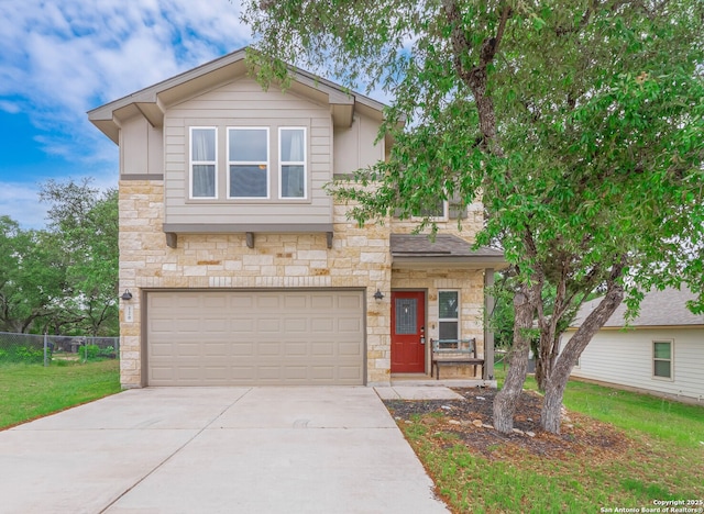 120 Lakeview Ct, Spring Branch, TX 78070 - view of front facade with fence, an attached garage, concrete driveway, stone siding, and a front lawn