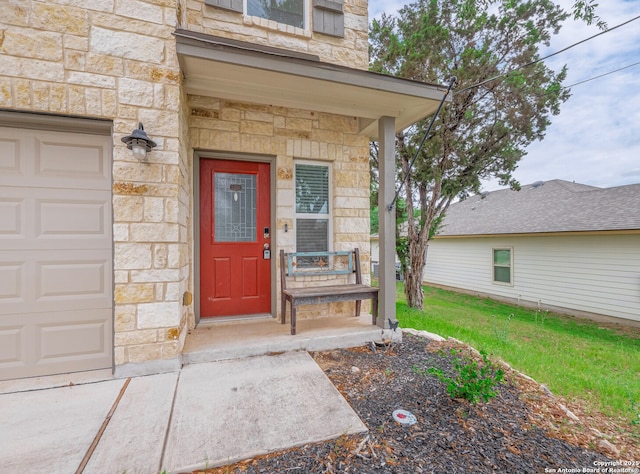 120 Lakeview Ct, Spring Branch, TX 78070 - doorway to property featuring a garage, stone siding, and a lawn