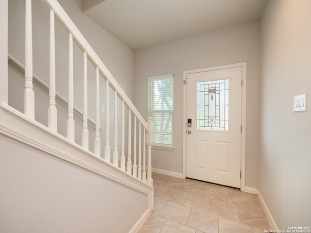 120 Lakeview Ct, Spring Branch, TX 78070 - tiled entrance foyer featuring baseboards and stairs