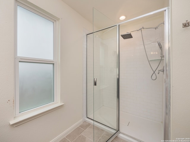 120 Lakeview Ct, Spring Branch, TX 78070 - bathroom featuring tile patterned floors, baseboards, and a shower stall