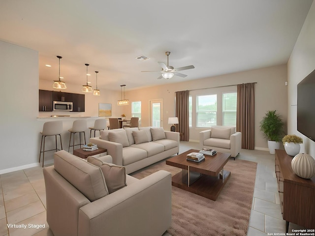120 Lakeview Ct, Spring Branch, TX 78070 - living room with a ceiling fan, visible vents, baseboards, and light tile patterned flooring