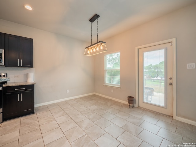120 Lakeview Ct, Spring Branch, TX 78070 - unfurnished dining area featuring baseboards, light tile patterned flooring, and recessed lighting
