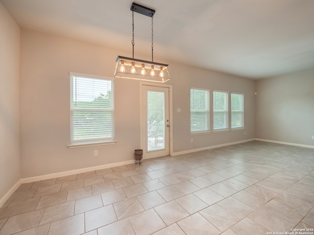 120 Lakeview Ct, Spring Branch, TX 78070 - empty room featuring baseboards, a healthy amount of sunlight, and light tile patterned flooring