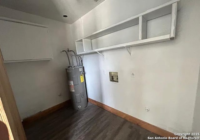 1107 Willow, Jourdanton, TX 78026 - laundry area featuring laundry area, hookup for a washing machine, dark wood finished floors, baseboards, and electric water heater