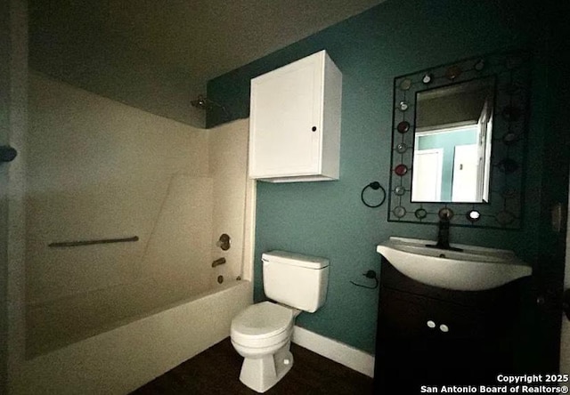 1107 Willow, Jourdanton, TX 78026 - bathroom featuring toilet, baseboards, vanity, and shower / bath combination