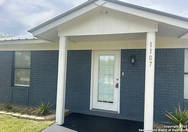1107 Willow, Jourdanton, TX 78026 - property entrance with board and batten siding and brick siding