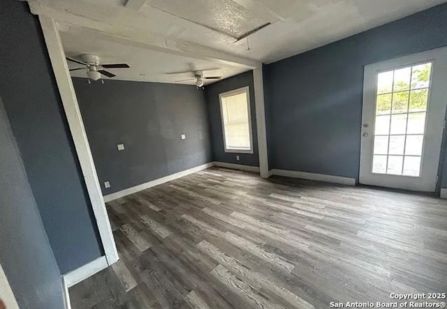 1107 Willow, Jourdanton, TX 78026 - empty room featuring attic access, a ceiling fan, plenty of natural light, and wood finished floors
