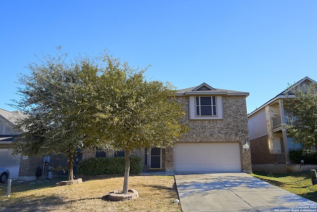 242 Posey Pass, New Braunfels, TX 78132 - view of property hidden behind natural elements featuring driveway, brick siding, and a garage