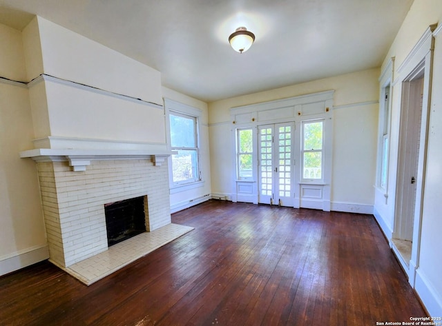 602 W French Pl, San Antonio, TX 78212 - unfurnished living room featuring a fireplace, baseboards, and hardwood / wood-style floors