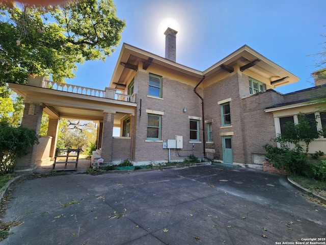 602 W French Pl, San Antonio, TX 78212 - rear view of house with brick siding and a chimney