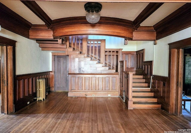602 W French Pl, San Antonio, TX 78212 - stairs with radiator heating unit, crown molding, a wainscoted wall, and wood finished floors