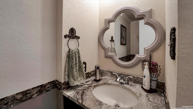 6139 Mackenzie, San Antonio, TX 78247 - bathroom featuring a textured wall and vanity