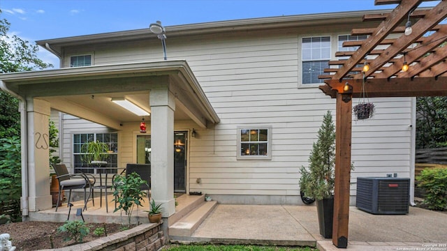 6139 Mackenzie, San Antonio, TX 78247 - back of property featuring central air condition unit, a pergola, and a patio area