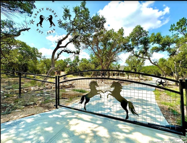 view of gate featuring fence