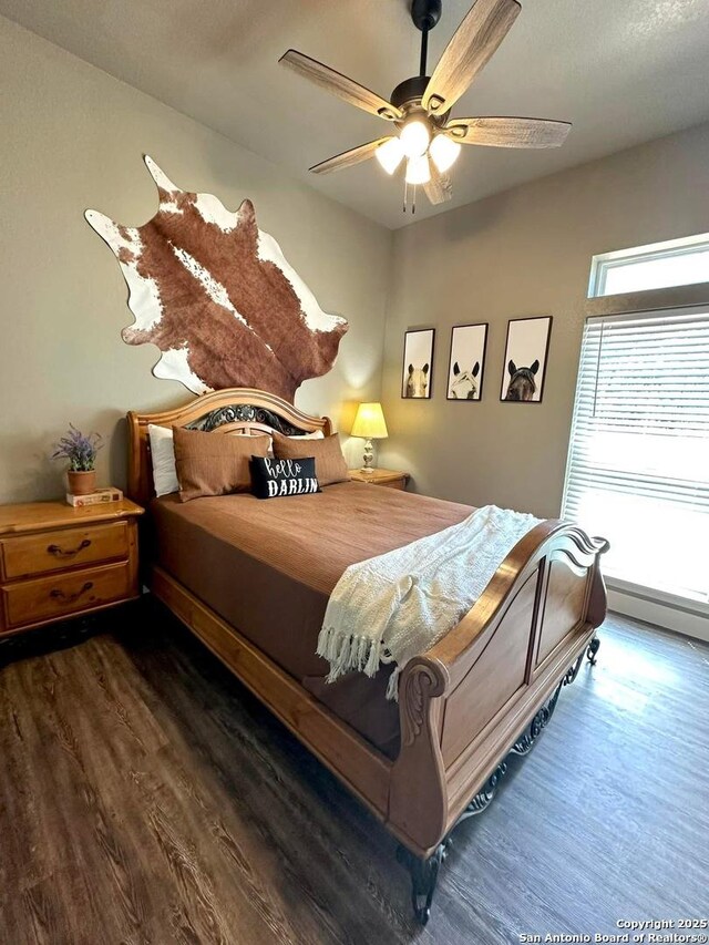 181 Crazy Horse, Canyon Lake, TX 78133 - bedroom with ceiling fan and wood finished floors