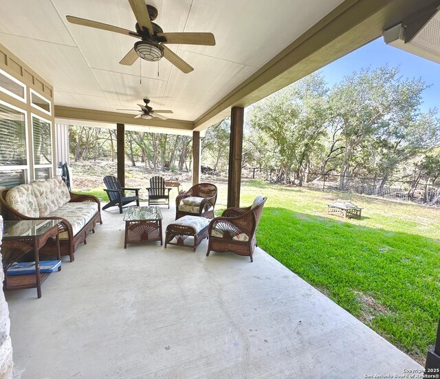 181 Crazy Horse, Canyon Lake, TX 78133 - view of patio with an outdoor living space with a fire pit and ceiling fan