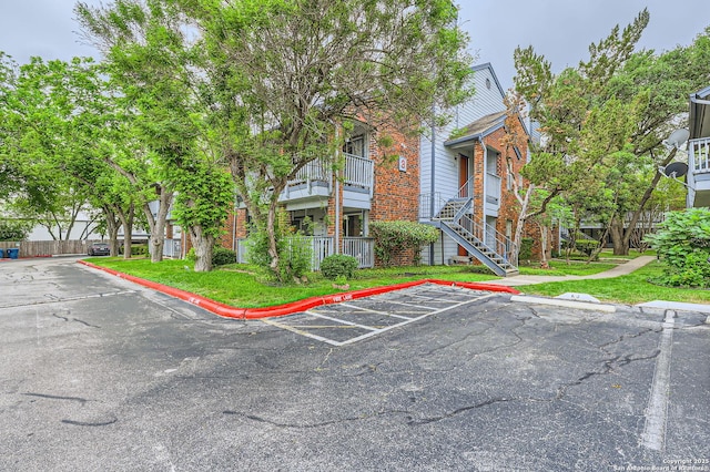 14343 Judson Unit 303, San Antonio, TX 78233 - exterior space with brick siding and uncovered parking