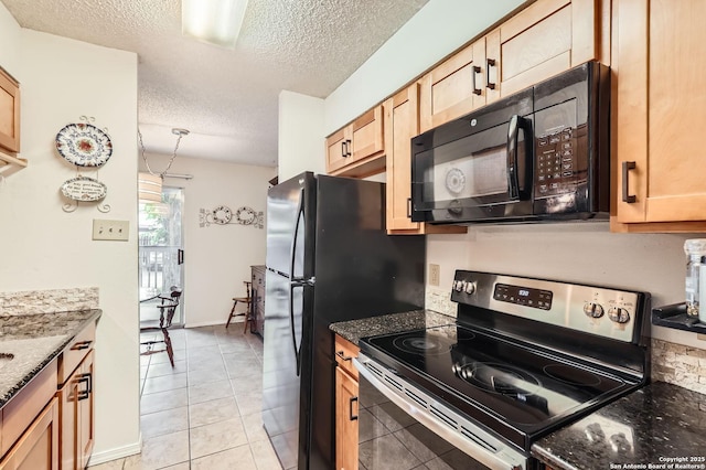 14343 Judson Unit 303, San Antonio, TX 78233 - kitchen featuring a textured ceiling, stainless steel electric range, black microwave, and dark stone counters