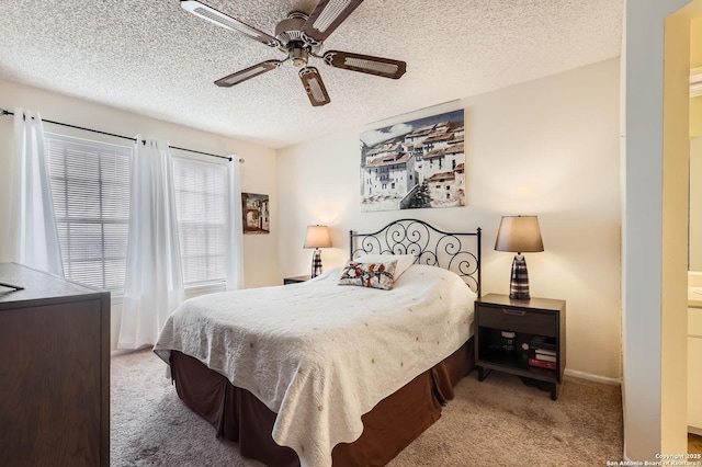 14343 Judson Unit 303, San Antonio, TX 78233 - carpeted bedroom with a textured ceiling and a ceiling fan