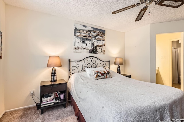 14343 Judson Unit 303, San Antonio, TX 78233 - bedroom with a textured ceiling, baseboards, ceiling fan, and carpet