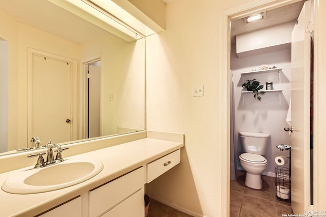 14343 Judson Unit 303, San Antonio, TX 78233 - bathroom featuring toilet, baseboards, tile patterned flooring, and vanity