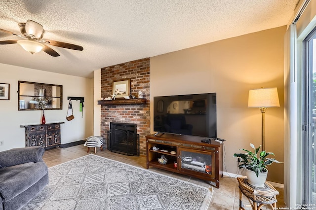 14343 Judson Unit 303, San Antonio, TX 78233 - tiled living room with a textured ceiling, a fireplace, and ceiling fan