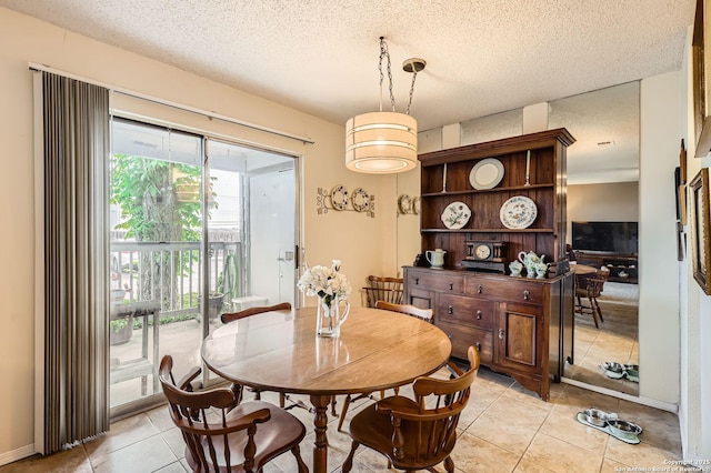 14343 Judson Unit 303, San Antonio, TX 78233 - dining space featuring a textured ceiling and light tile patterned floors