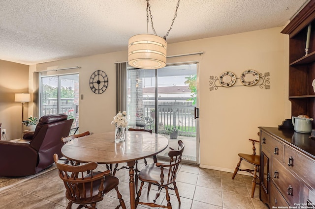 14343 Judson Unit 303, San Antonio, TX 78233 - dining room with light tile patterned floors and a textured ceiling
