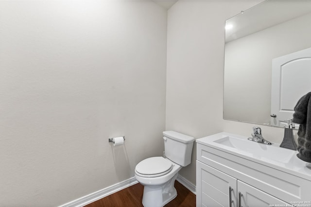 15102 Jetfire, Von Ormy, TX 78073 - bathroom featuring baseboards, vanity, toilet, and wood finished floors