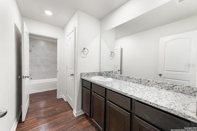 15102 Jetfire, Von Ormy, TX 78073 - full bathroom with wood finished floors, vanity, recessed lighting, baseboards, and bathtub / shower combination