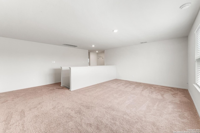 15102 Jetfire, Von Ormy, TX 78073 - spare room featuring light colored carpet, visible vents, and recessed lighting
