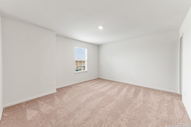 15102 Jetfire, Von Ormy, TX 78073 - spare room featuring light carpet, baseboards, and recessed lighting