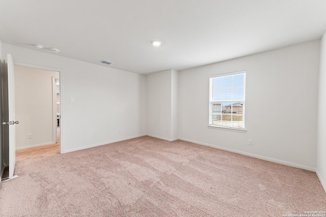 15102 Jetfire, Von Ormy, TX 78073 - empty room featuring light carpet, baseboards, and visible vents
