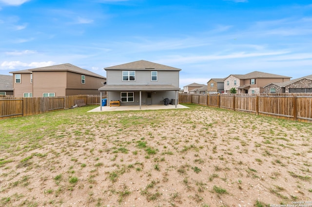 15102 Jetfire, Von Ormy, TX 78073 - back of house featuring a yard, a patio area, a residential view, and a fenced backyard