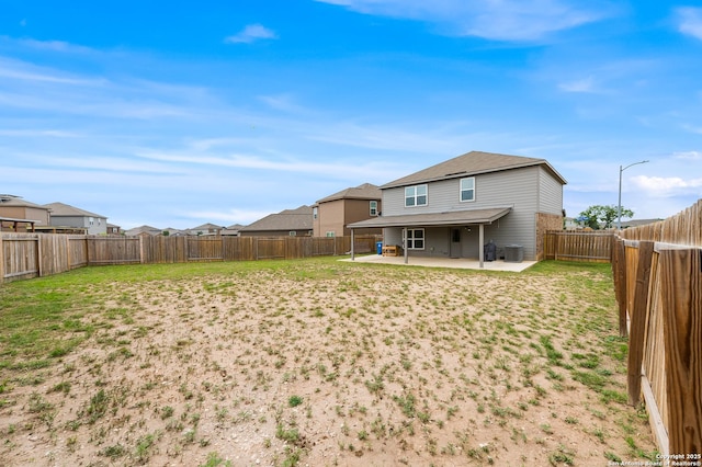 15102 Jetfire, Von Ormy, TX 78073 - rear view of property with a patio area, a lawn, and a fenced backyard