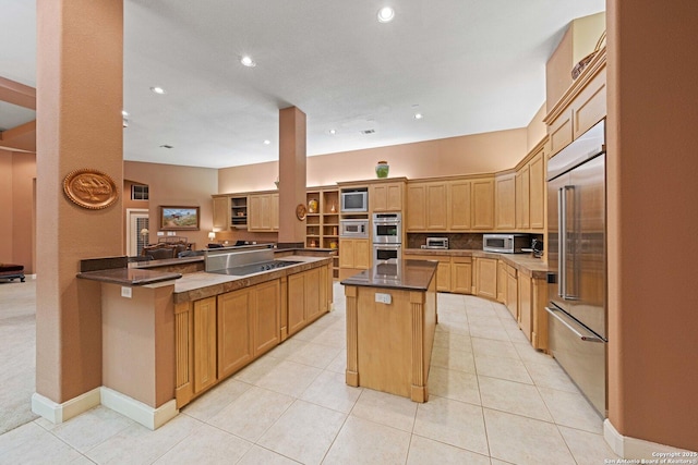 26118 Alto Oaks, San Antonio, TX 78255 - kitchen featuring appliances with stainless steel finishes, recessed lighting, a center island, light tile patterned floors, and baseboards