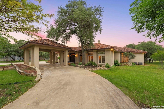 26118 Alto Oaks, San Antonio, TX 78255 - mediterranean / spanish home with stucco siding, a tiled roof, a chimney, and a front lawn