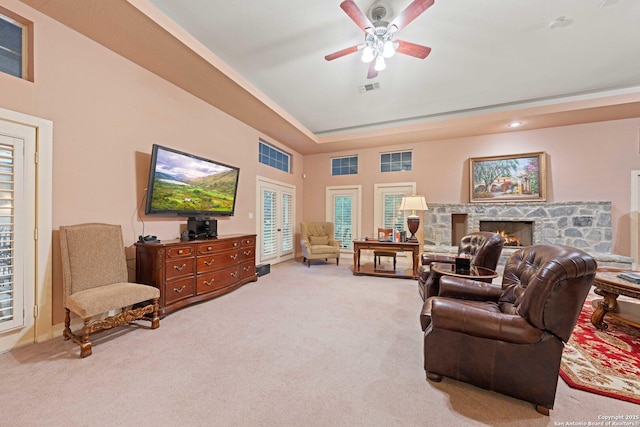 26118 Alto Oaks, San Antonio, TX 78255 - living area featuring ceiling fan, light carpet, a fireplace, and a tray ceiling
